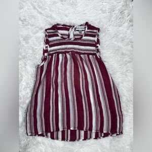 Red and white sleeveless high / low top